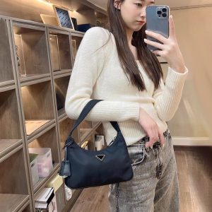 Prada Replica Bags/Hand Bags Material: Nylon Bag Type: Dumpling Bun Bag Type: Dumpling Bun Bag Size: 23*5*13cm Lining Material: Polyester Cotton Closure Type: Zipper Pattern: Solid Color