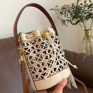Tory Burch Bags/Hand Bags Brand: Tory Burch Texture: Cowhide Texture: Cowhide Type: Bucket Bag Popular Elements: Hollow Out Style: Fashion Closed Way: Drawstring Buckle
