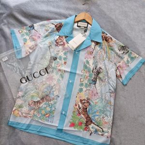 Gucci Replica Men Clothing Fabric Material: Other Version: Loose Version: Loose Collar: Pointed Collar (Regular) Sleeve Length: Short Sleeve Clothing Style Details: Button
