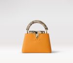 Fake Louis Vuitton Capucines Mini LV Bag Golden Yellow N81410. This exotic piece cannot be shipped to CaliFornia. The vibrant golden-yellow Taurillon leather blends beautifully with the natural python leather on the flap and handle of this eye-catching Capucines Mini handbag. Carried by hand