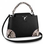 Knockoff Louis Vuitton fake LV Capucines PM Bag Python N94410 BLV841. Fashioned from Taurillon leather with precious python leather pads on its four corners as well as its handle