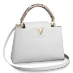 Knockoff Louis Vuitton fake LV Capucines PM Bag With Python Handle N93045 BLV835. The iconic Capucines PM handbag combines beige Taurillon leather with exotic python skin in this luxurious seasonal edition. The LV Initials accessory