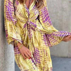 This Women's Fashion Chic Print Long Sleeve v Neck Tie Dress Design Made Of High Quality Polyster And Spandex Material. It Is Stretchy