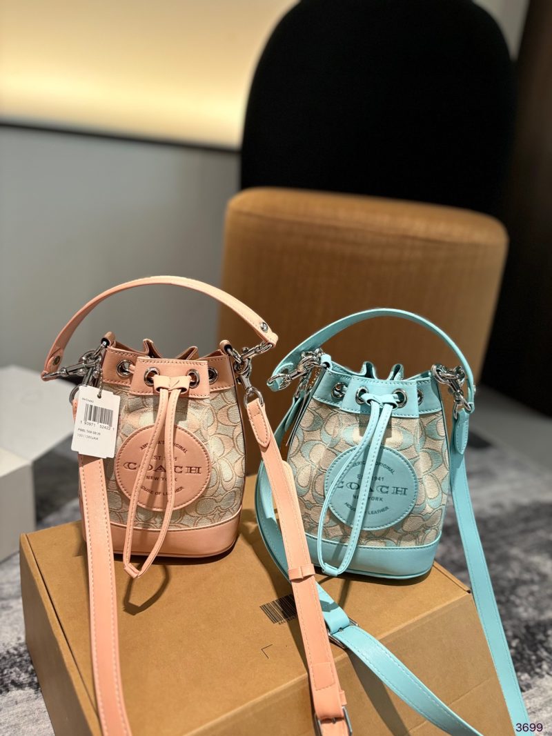 The Coach bucket bag with airplane case is here