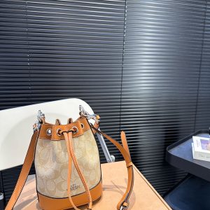 The Coach bucket bag with airplane case is here