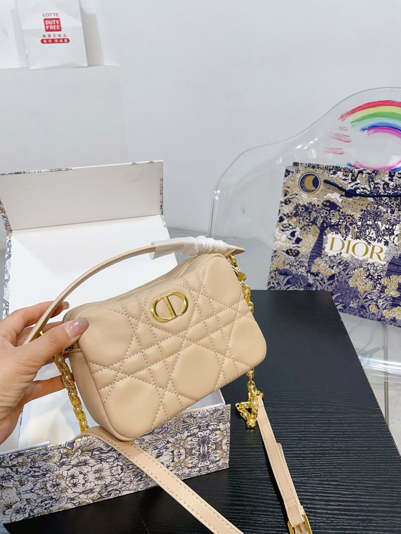 Dior's new dior camera bag can be carried by hand or shoulder