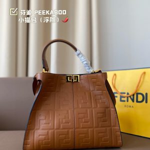 Fendi's 88th anniversary FENDI handbag has a smooth texture and topstitching. Both compartments open and close with the classic ABOO twist lock. Hard dividers and one zippered pocket. Single handle