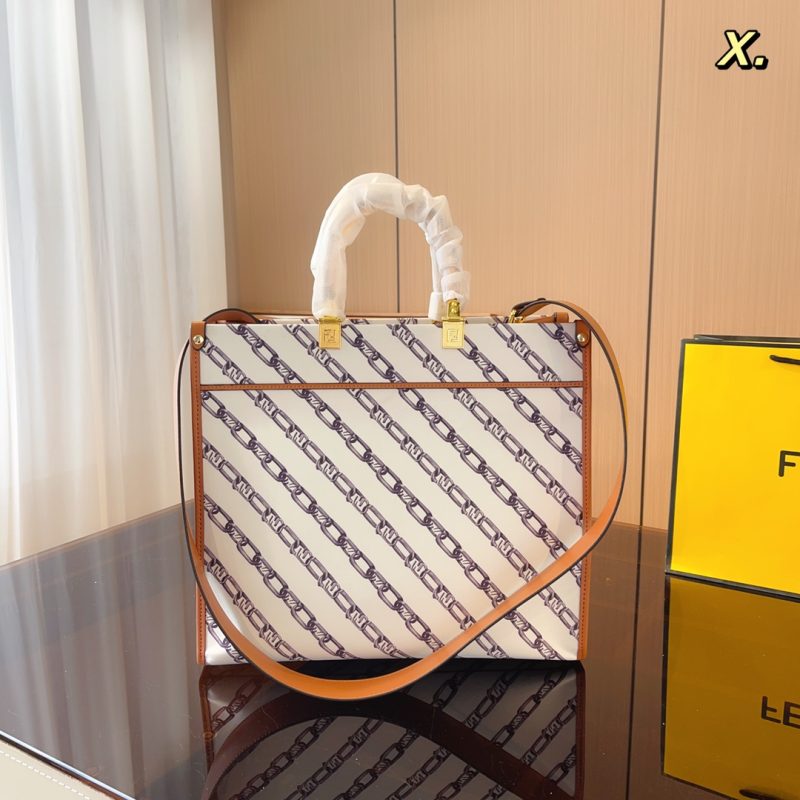 Fendi's 88th anniversary FENDI handbag has a smooth texture and topstitching. Both compartments open and close with the classic EEKABOO twist lock. Hard dividers and one zippered pocket. Single handle