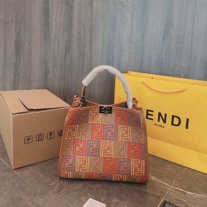 Fendi's 88th anniversary FENDI handbag has a smooth texture and topstitching. Both compartments open and close with the classic EEKABOO twist lock. Hard dividers and one zippered pocket. Single handle