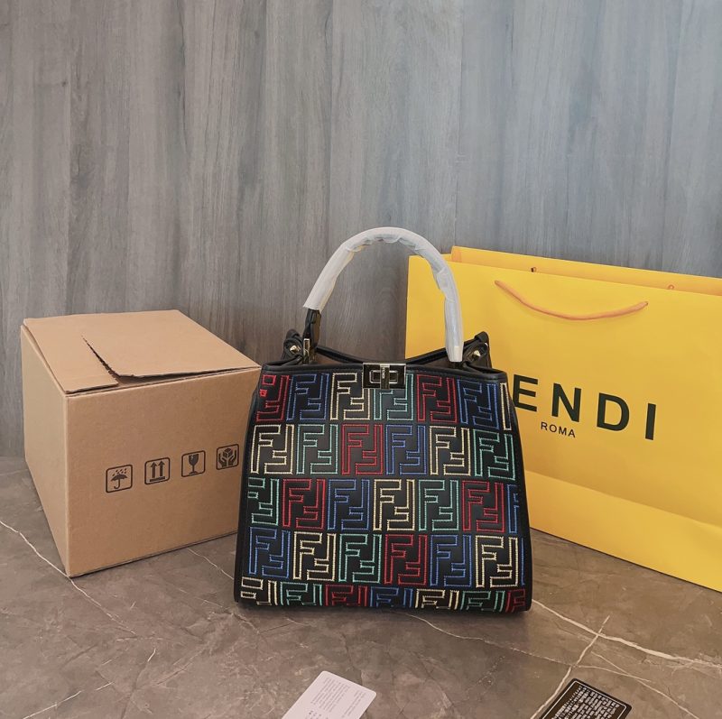 Fendi's 88th anniversary FENDI handbag has a smooth texture and topstitching. Both compartments open and close with the classic EEKABOO twist lock. Hard dividers and one zippered pocket. Single handle