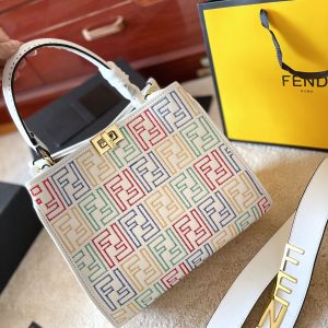 Fendi's 88th anniversary FENDI handbag has a smooth texture and topstitching. Both compartments open and close with the classic EEKABOO twist lock. Hard dividers and one zippered pocket. Single handle