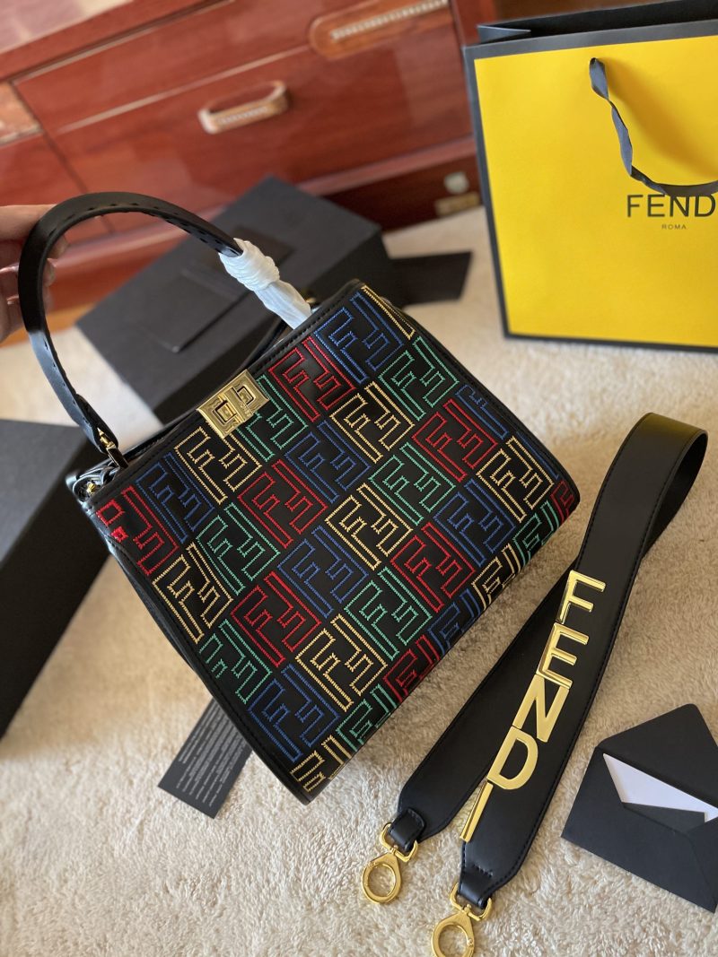 Fendi's 88th anniversary FENDI handbag has a smooth texture and topstitching. Both compartments open and close with the classic EEKABOO twist lock. Hard dividers and one zippered pocket. Single handle