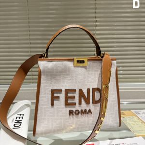 Fendi's 88th anniversary FENDI handbag has a smooth texture and topstitching. Both compartments open and close with the classic EEKABOO twist lock. Hard dividers and one zippered pocket. Single handle