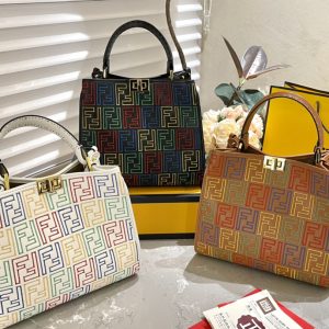 Fendi's 88th anniversary FENDI handbag has a smooth texture and topstitching. Both compartments open and close with the classic EEKABOO twist lock. Hard dividers and one zippered pocket. Single handle