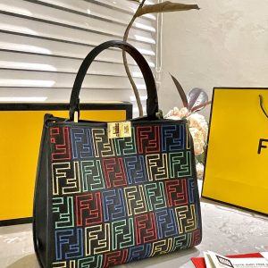 Fendi's 88th anniversary FENDI handbag has a smooth texture and topstitching. Both compartments open and close with the classic EEKABOO twist lock. Hard dividers and one zippered pocket. Single handle