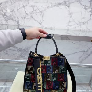 Fendi's 88th anniversary FENDI handbag has a smooth texture and topstitching. Both compartments open and close with the classic EEKABOO twist lock. Hard dividers and one zippered pocket. Single handle