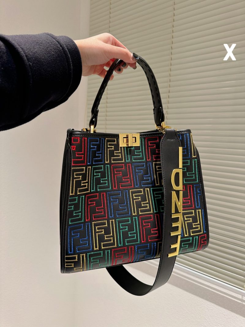 Fendi's 88th anniversary FENDI handbag has a smooth texture and topstitching. Both compartments open and close with the classic EEKABOO twist lock. Hard dividers and one zippered pocket. Single handle