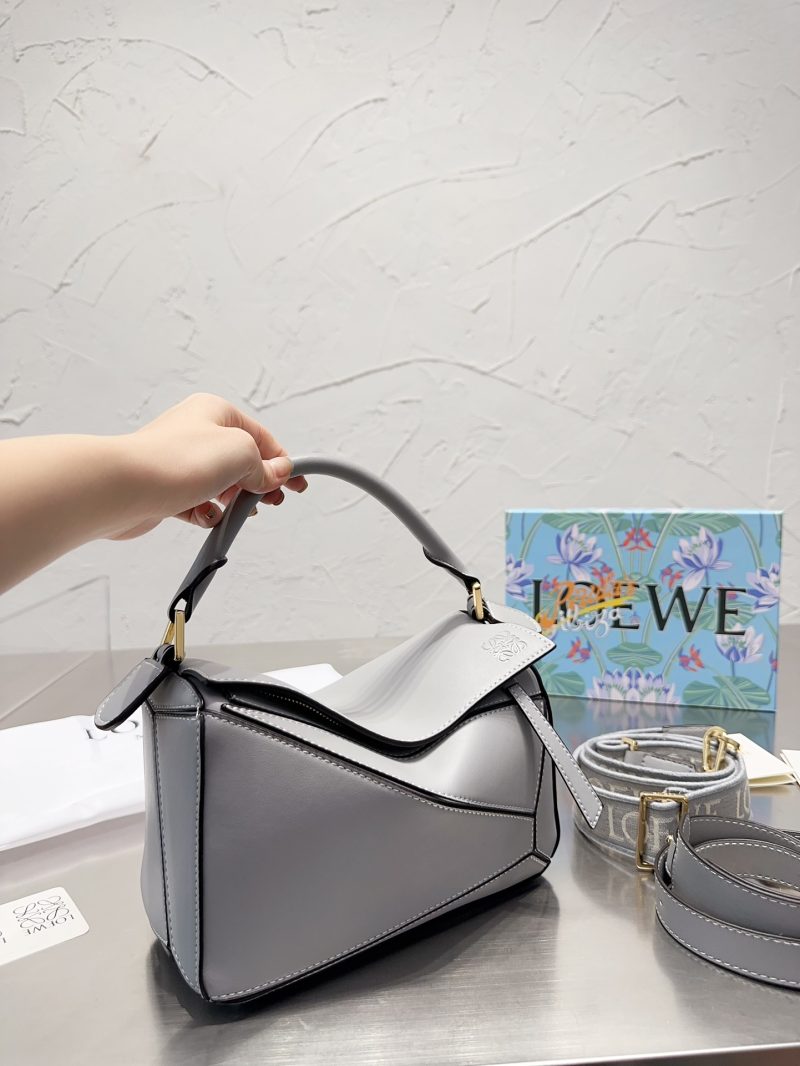 Loewe's geometric bag makes me wait for the puzzle with its own wide shoulder strap!